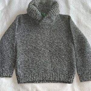 Little boys sweater with collar .
